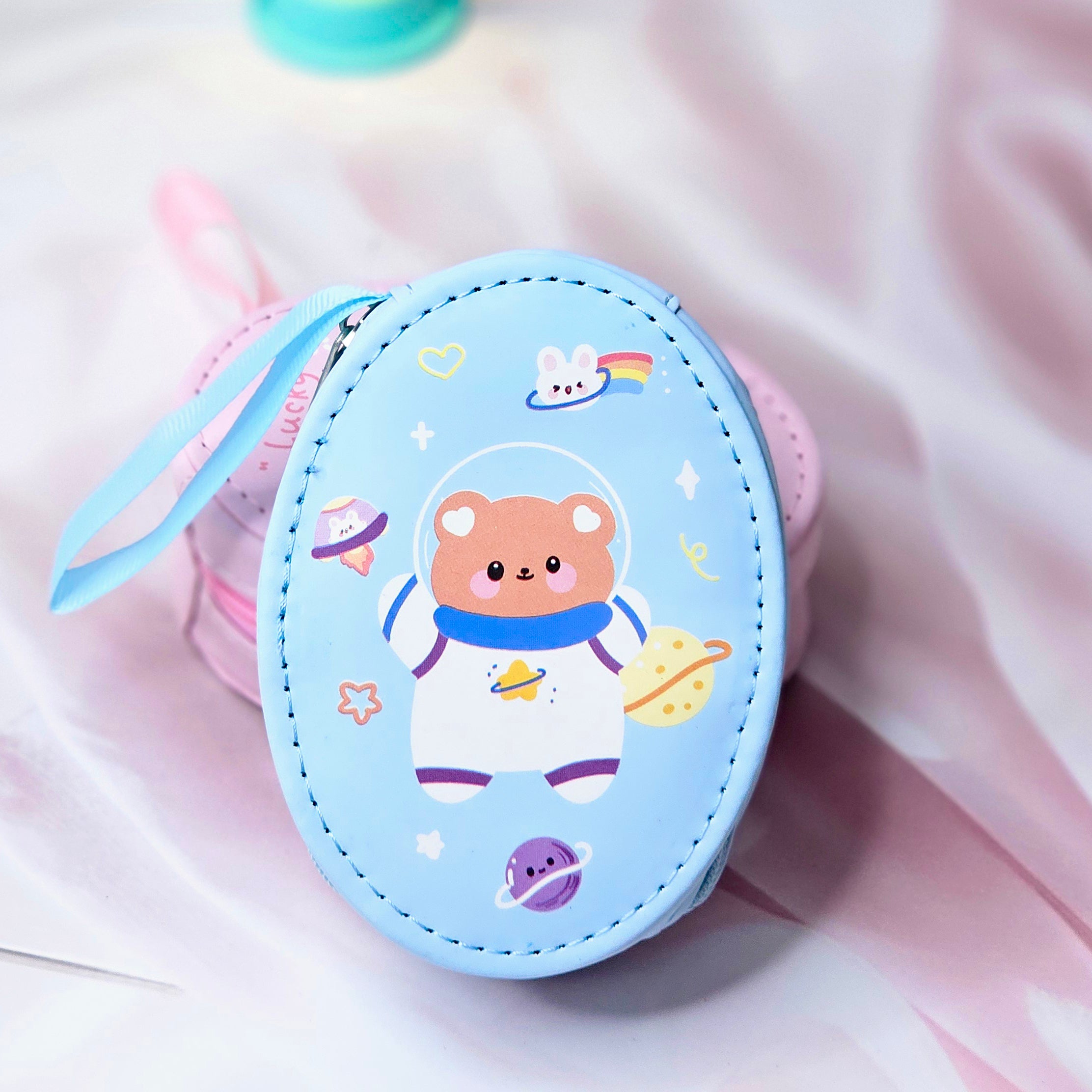 Six colorful cute cartoon oval mini zipper pouches with bear, bunny, duck, cake, and cloud designs, perfect for coins, earphones, and small accessories